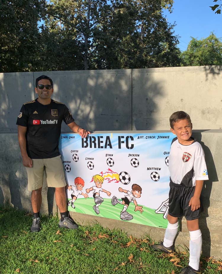 Omar Martinez with son